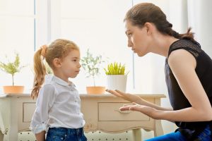 Mom talking to her daughter